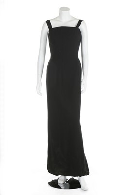 Lot 101 - A couture black silk crepe sheath, probably...