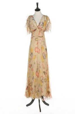 Lot 108 - A printed chiffon garden party gown, early...
