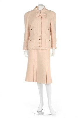 Lot 140 - A Chanel couture pale pink tweed suit, late...