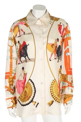 Lot 141 - An Hermès 'Plaza de Toros' printed silk blouse,...