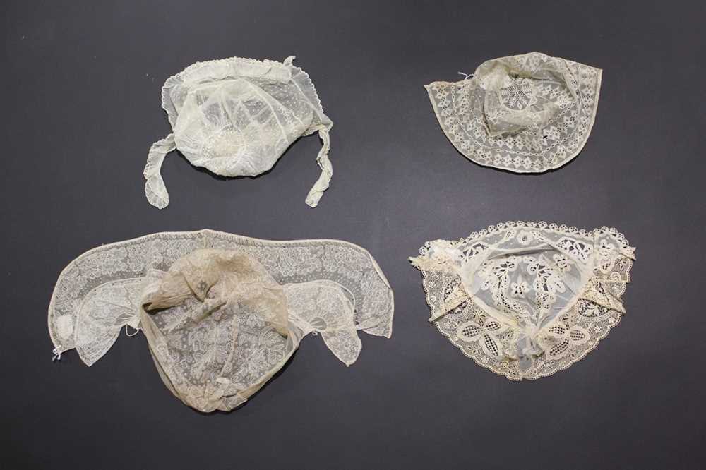 Lot 319 - A collection of women's caps, 1800-1920,...