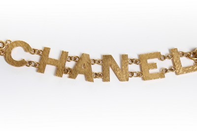 Lot 207 - A Chanel black leather belt, 1980s, the strap...