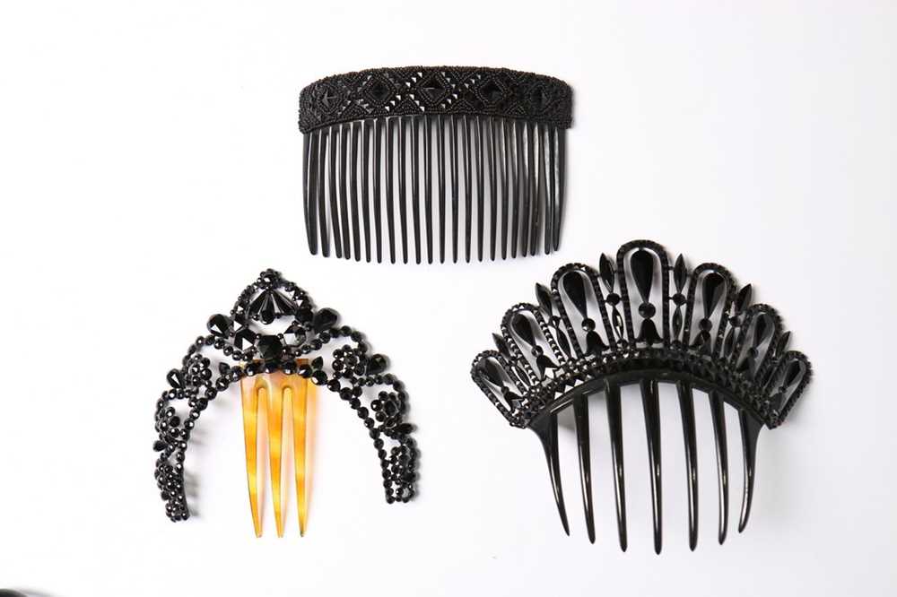 Lot 214 - A collection of jet glass beaded hair combs,...