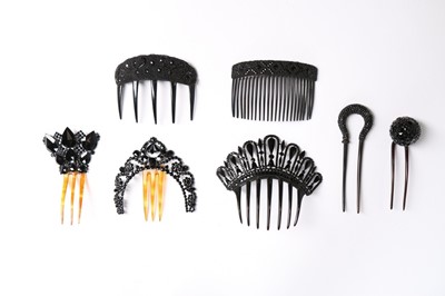 Lot 214 - A collection of jet glass beaded hair combs,...