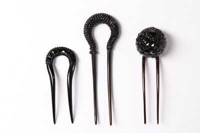 Lot 214 - A collection of jet glass beaded hair combs,...