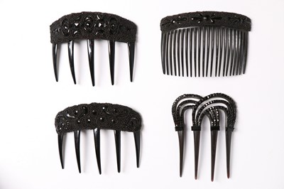 Lot 214 - A collection of jet glass beaded hair combs,...