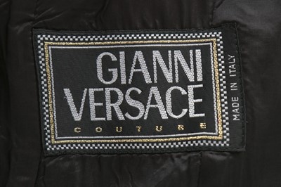 Lot 3 - A Gianni Versace dark grey pin-striped suit...