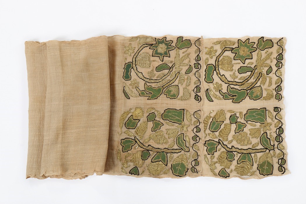 Lot 374 An embroidered scarlet velvet bolster cover,