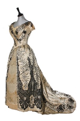 Lot 172 - A couture beaded ivory satin evening gown,...