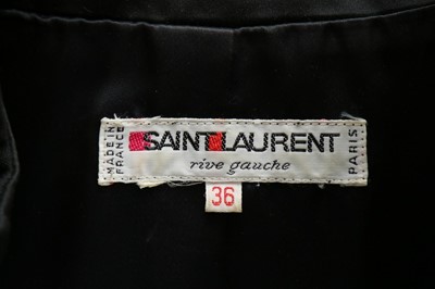 Lot 19 - An Yves Saint Laurent 'Le Smoking' skirt suit,...