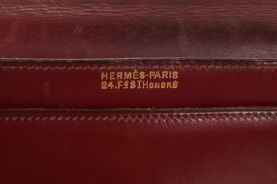 Lot 72 - An Hermès ox blood leather 'Tourniquet' bag,...