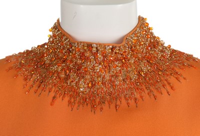 Lot 105 - A Lanvin couture orange silk crêpe evening...