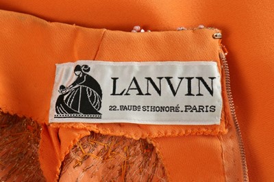Lot 105 - A Lanvin couture orange silk crêpe evening...