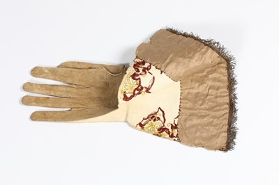 Lot 12 - A single buff leather glove, traditionally...