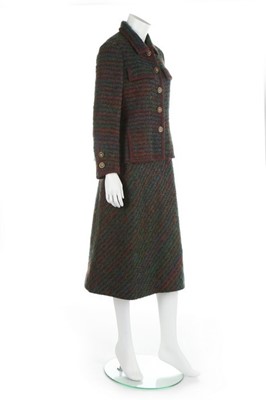 Lot 131 - A Chanel couture tweed suit, late 1970s,...