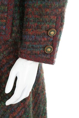 Lot 131 - A Chanel couture tweed suit, late 1970s,...