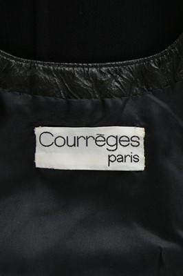 Lot 143 - A Courrges black wool crpe and vinyl edged...