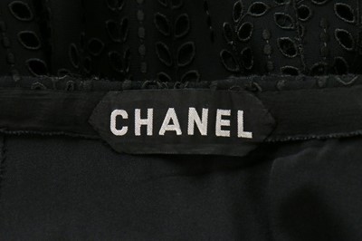 Lot 130 - A Chanel couture broderie anglaise black crêpe...