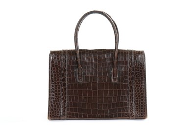 Lot 11 - An Hermès brown crocodile 'Drag' bag and...