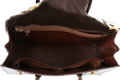 Lot 11 - An Hermès brown crocodile 'Drag' bag and...