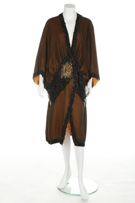 Lot 53 - A beaded opera coat, circa 1915-20, the...
