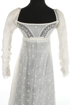 Lot 36 - A sprigged muslin dress, circa 1800, the...