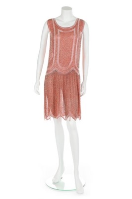 Lot 74 - A salmon-pink muslin flapper dress, circa 1926-...