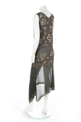 Lot 67 - A black and gold muslin flapper dress, circa...