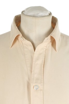 Lot 82 - Winston Churchill's cream silk night-shirt,...