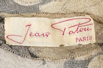 Lot 98 - A Jean Patou printed floral lamé jacket, late...
