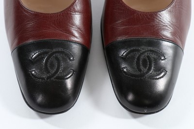 Lot 51 - Chanel footwear, comprising black and ivory...