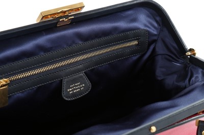 Lot 55 - A Smythson pink and navy leather bag, with...