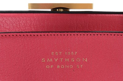 Lot 55 - A Smythson pink and navy leather bag, with...
