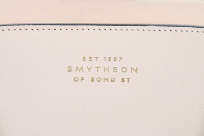 Lot 56 - A Smythson cream and navy leather bag, with...