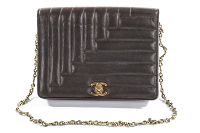 Lot 71 - A Chanel brown quilted leather handbag, 1980s,...