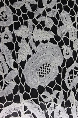 Lot 411 - A good Honiton bobbin lace tri-angular shawl,...