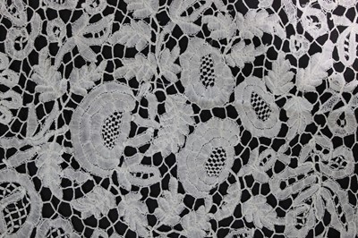 Lot 411 - A good Honiton bobbin lace tri-angular shawl,...