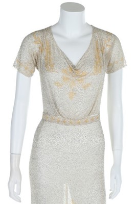 Lot 123 - A beaded silver tunic c.1914, the tulle ground...