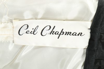 Lot 130 - A Ceil Chapman white guipure and black silk...
