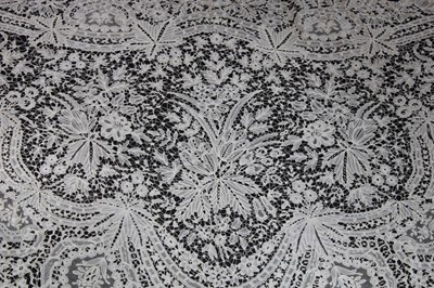 Lot 414 - A Brussels bobbin lace triangular shawl, circa...