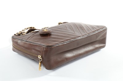 Lot 141 - A Chanel brown leather handbag, 1980s, with...
