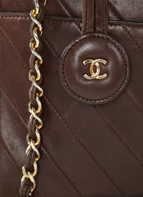 Lot 141 - A Chanel brown leather handbag, 1980s, with...