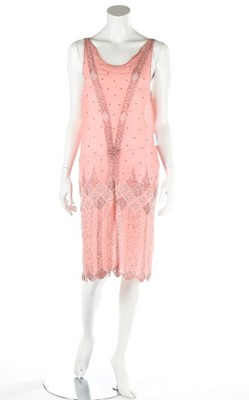 Lot 142 - A pale pink chiffon flapper dress, circa...