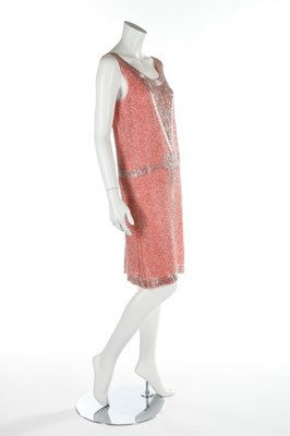 Lot 144 - A salmon-pink muslin flapper dress, circa 1928,...