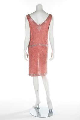 Lot 144 - A salmon-pink muslin flapper dress, circa 1928,...
