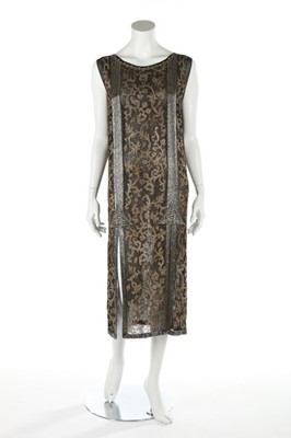 Lot 147 - A black and gold chiffon flapper dress, circa...