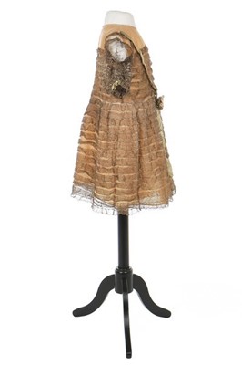 Lot 139 - A little girl's gold lace dress, late...