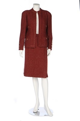 Lot 308 - A Chanel brick-red boucle suit, 1990s,...