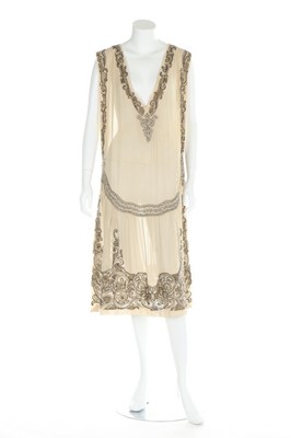 Lot 165 - A beaded silk crepe tabard style flapper dress...