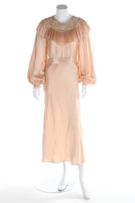 Lot 209 - An oyster satin bias cut gown, early 1930s,...